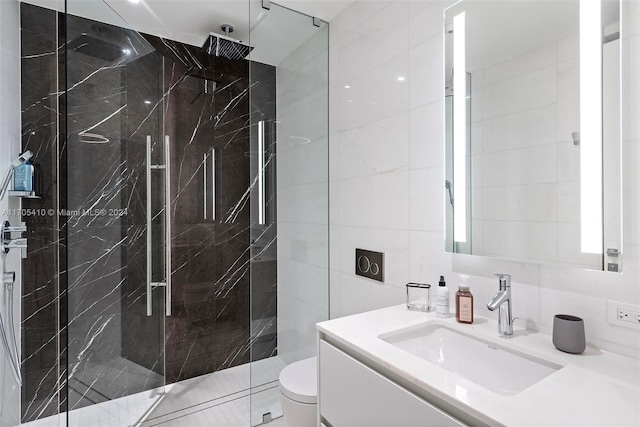 bathroom with toilet, vanity, tile walls, and tiled shower