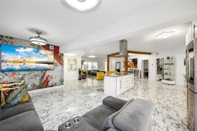 living room with beam ceiling