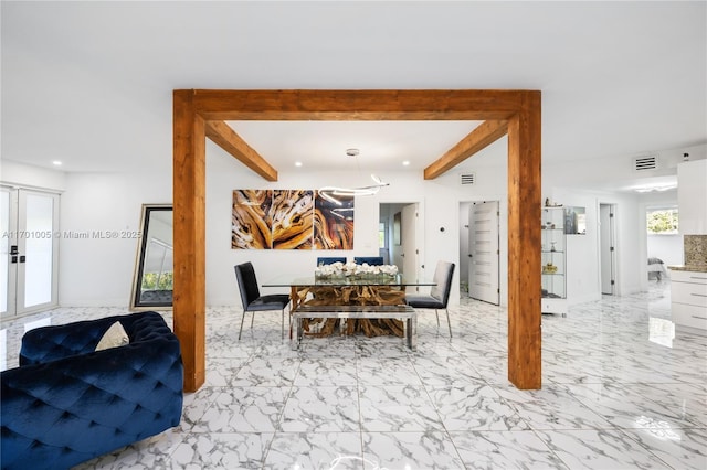 dining area featuring french doors and beamed ceiling