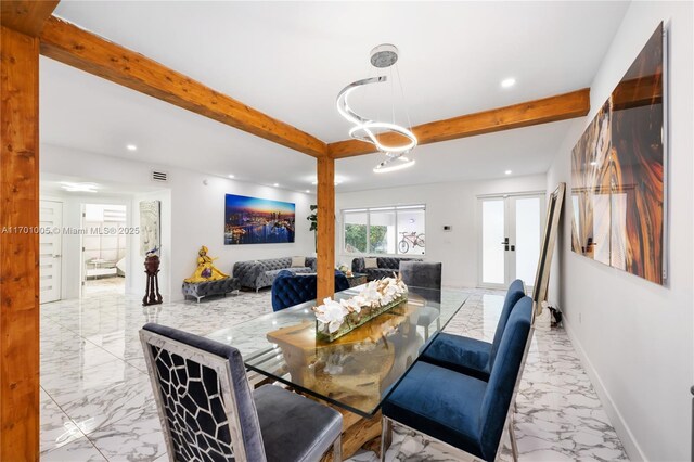 living room with beamed ceiling and french doors