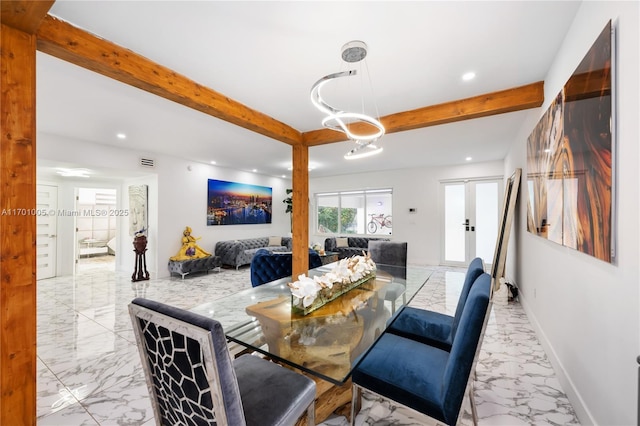 dining room featuring beamed ceiling and french doors