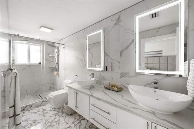 bathroom featuring vanity, toilet, and a shower