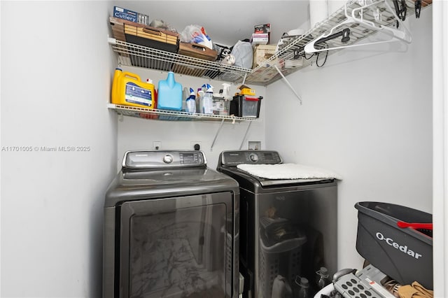 laundry room featuring washing machine and clothes dryer