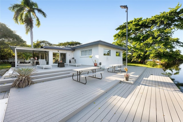 deck featuring a water view