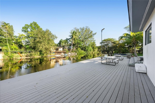 deck featuring a water view