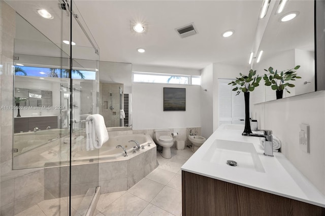 full bathroom featuring vanity, tile patterned flooring, a bidet, and shower with separate bathtub