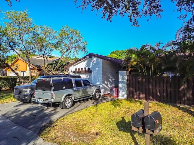 view of property exterior with a lawn