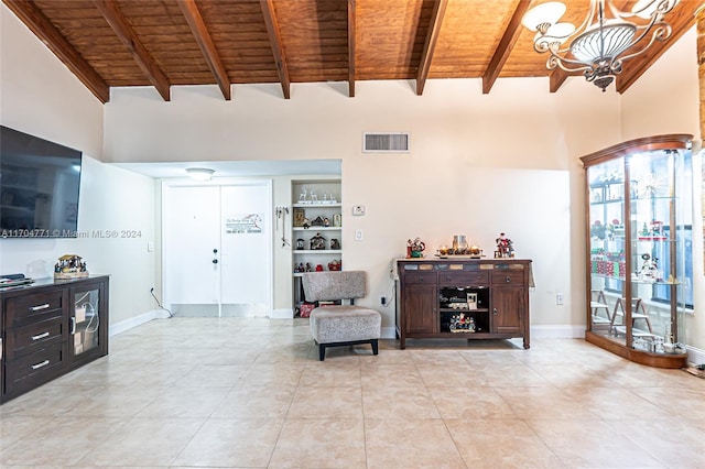 tiled living room featuring a notable chandelier, beam ceiling, wood ceiling, and high vaulted ceiling