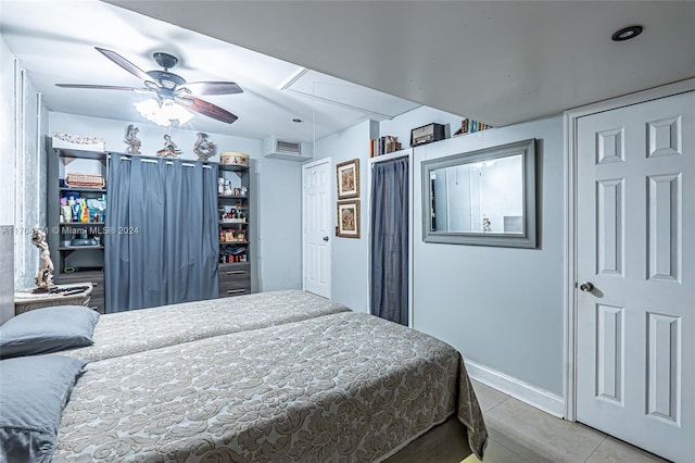 bedroom with light tile patterned floors and ceiling fan