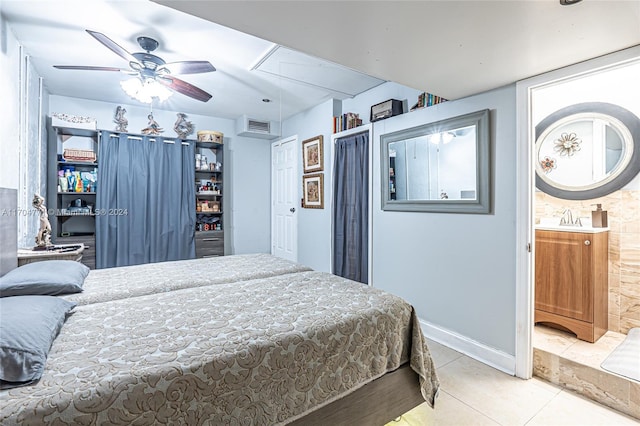 bedroom featuring ceiling fan, sink, and light tile patterned floors