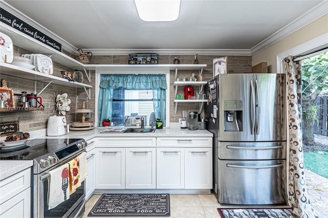 kitchen with sink, stainless steel appliances, tasteful backsplash, crown molding, and white cabinets