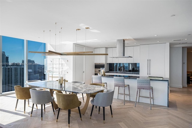 dining area with light parquet flooring