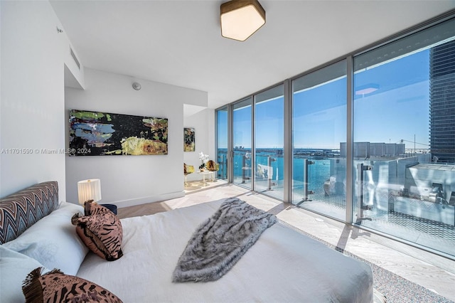 bedroom with floor to ceiling windows