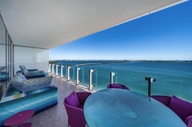 balcony featuring a water view