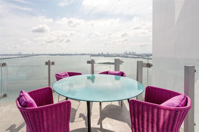 balcony featuring a water view