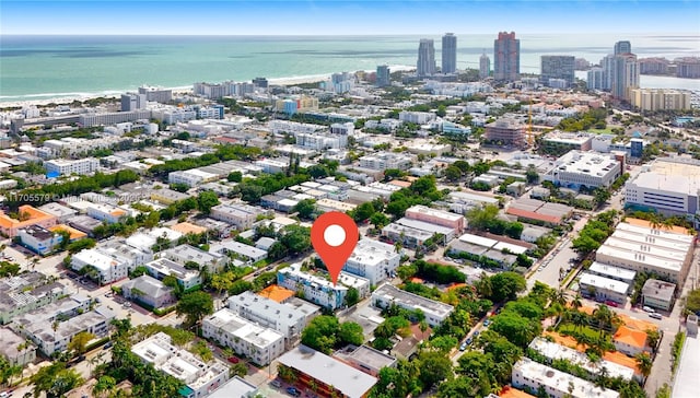 bird's eye view featuring a view of city and a water view