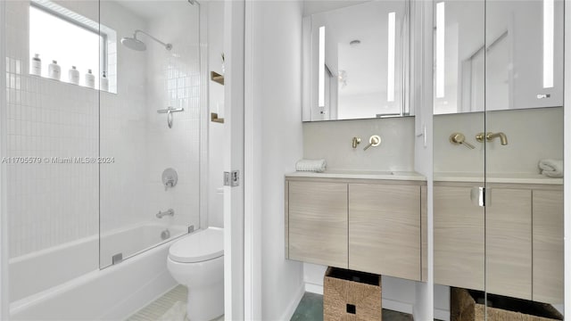 full bathroom featuring tile patterned flooring, vanity, toilet, and enclosed tub / shower combo