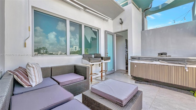 view of patio / terrace featuring an outdoor hangout area and a hot tub