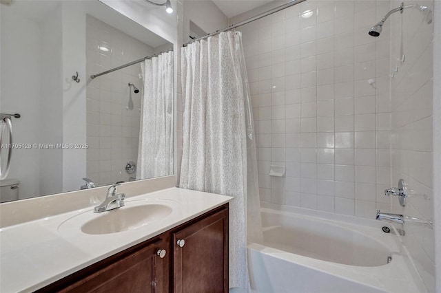 bathroom featuring shower / bath combo and vanity