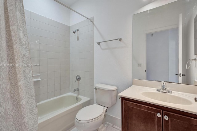 bathroom with toilet, shower / tub combination, and vanity