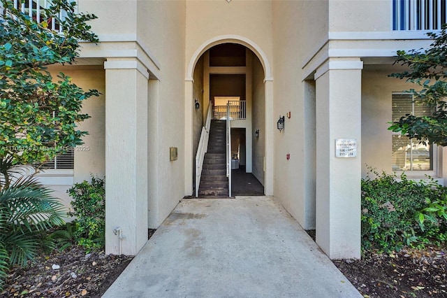 entrance to property with stucco siding