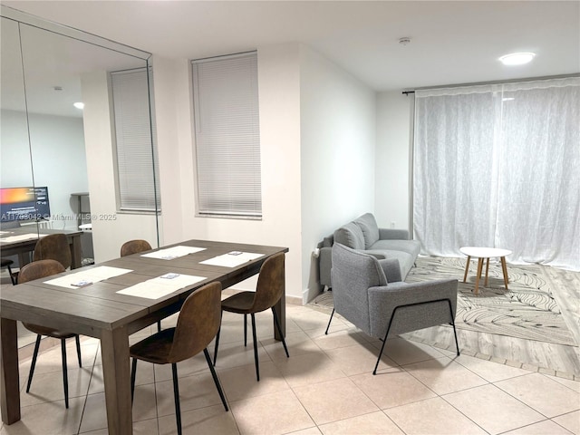 dining area featuring light tile patterned floors