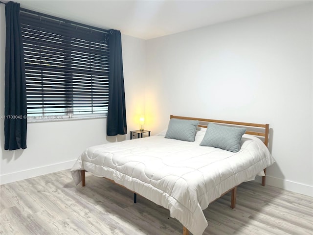 bedroom featuring light wood-type flooring