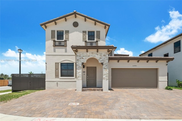 mediterranean / spanish house featuring a garage