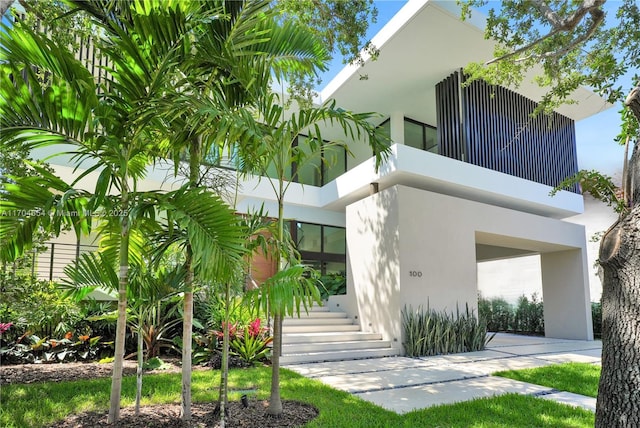 100 Hampton Ln, Key Biscayne, FL 33149 - exterior space featuring stucco siding and stairs