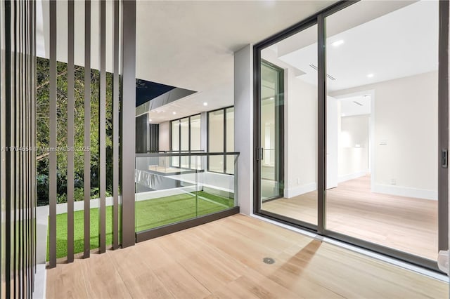 100 Hampton Ln, Key Biscayne, FL 33149 - entryway with baseboards and wood finished floors