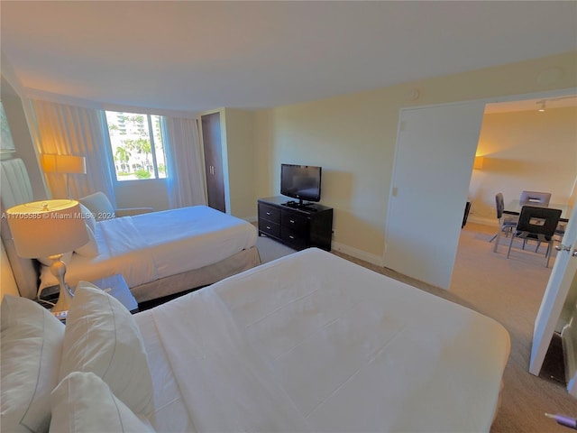 bedroom with light colored carpet