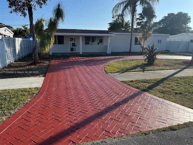 ranch-style house with a front yard