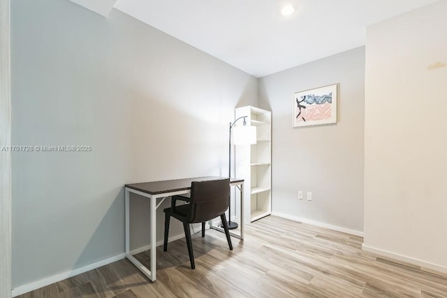 office space with light hardwood / wood-style flooring