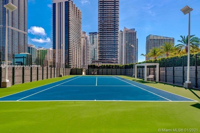 view of tennis court with basketball court