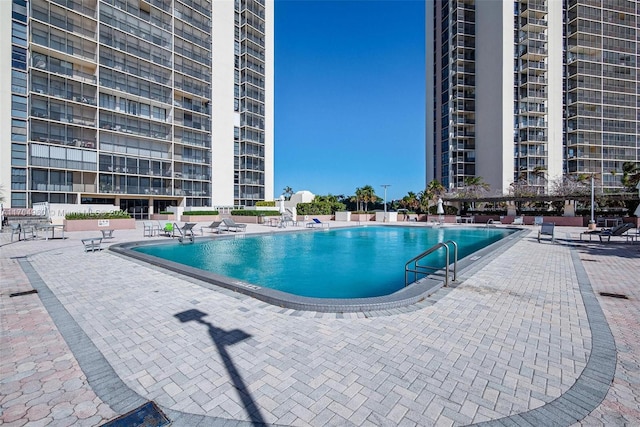 view of swimming pool with a patio