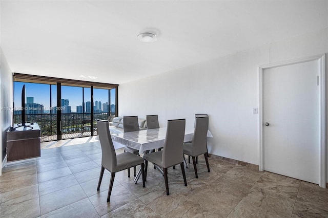 dining space featuring expansive windows