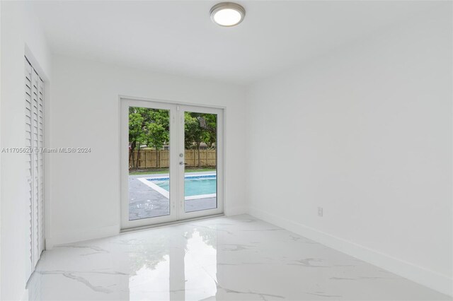 empty room featuring french doors