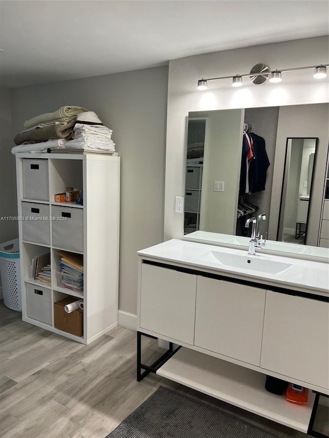 bathroom featuring vanity and wood-type flooring