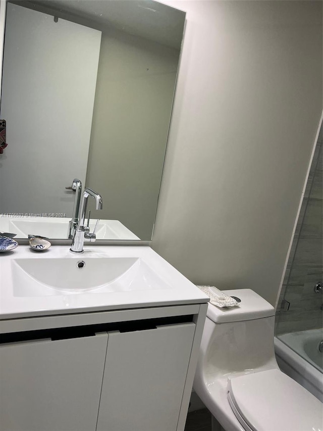 full bathroom featuring vanity, shower / bathtub combination, and toilet