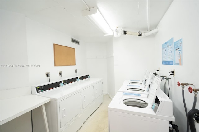 laundry room with washer and clothes dryer