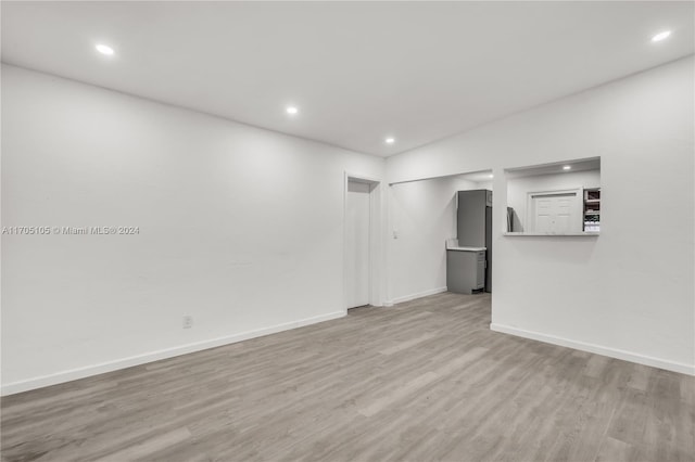 unfurnished living room with light hardwood / wood-style flooring