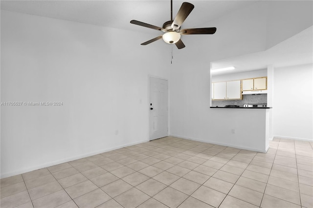 spare room with light tile patterned floors and ceiling fan