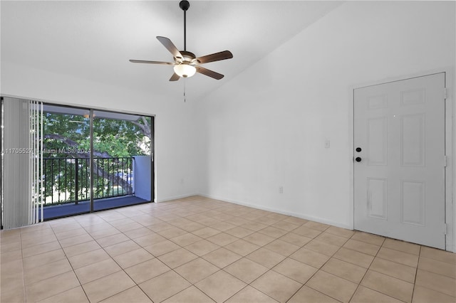 spare room with ceiling fan, high vaulted ceiling, and light tile patterned flooring