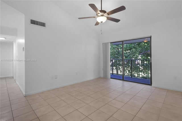 unfurnished room featuring vaulted ceiling, ceiling fan, and light tile patterned flooring