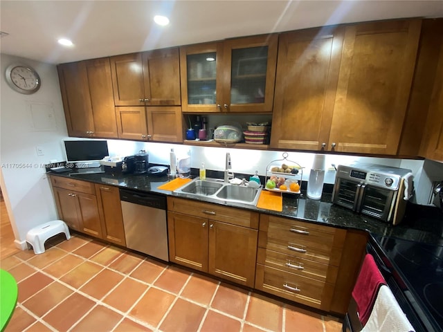 kitchen with dishwasher, sink, dark stone countertops, black range with electric cooktop, and light tile patterned flooring