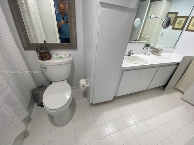 bathroom with tile patterned floors, vanity, and toilet