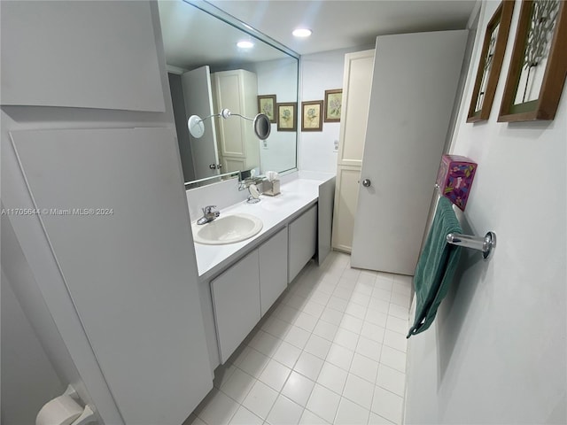 bathroom with tile patterned flooring and vanity