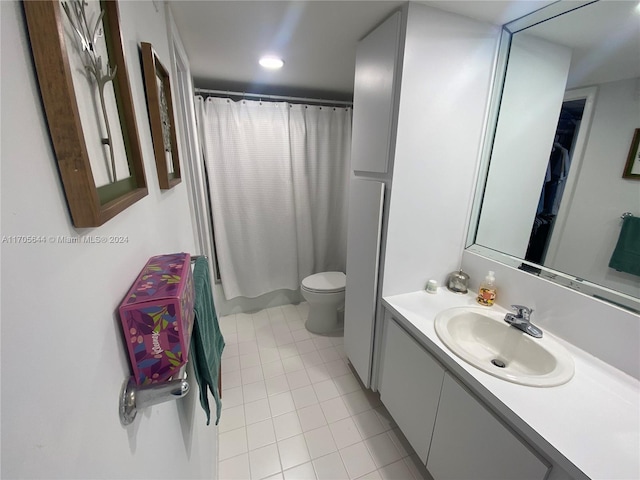 bathroom with tile patterned floors, vanity, toilet, and a shower with shower curtain