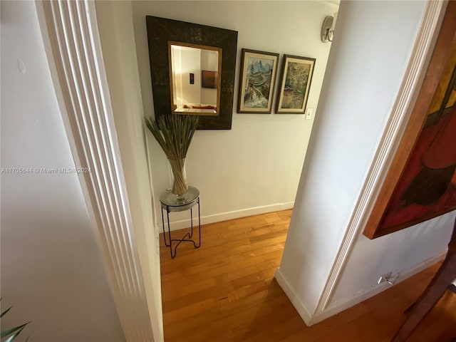 corridor featuring hardwood / wood-style flooring