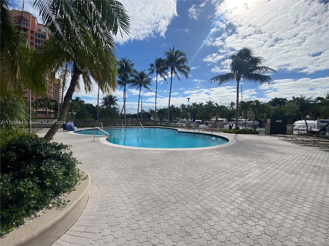 view of swimming pool with a patio